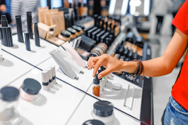 Woman Chooses Cosmetics And Make Up Products In A Store